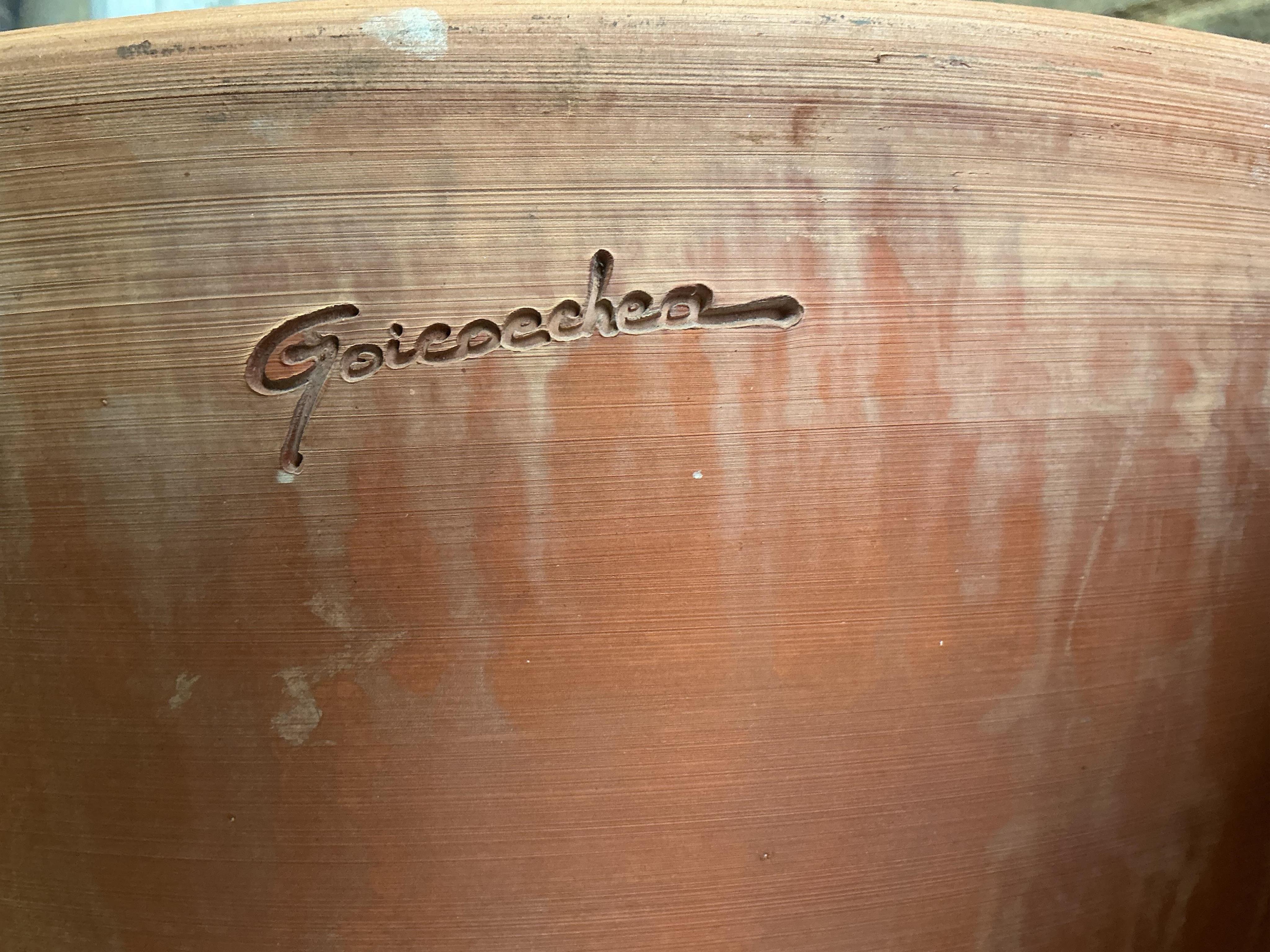 A pair of Goicoechea circular pottery planters with tray bases, diameter 54cm, height 53cm